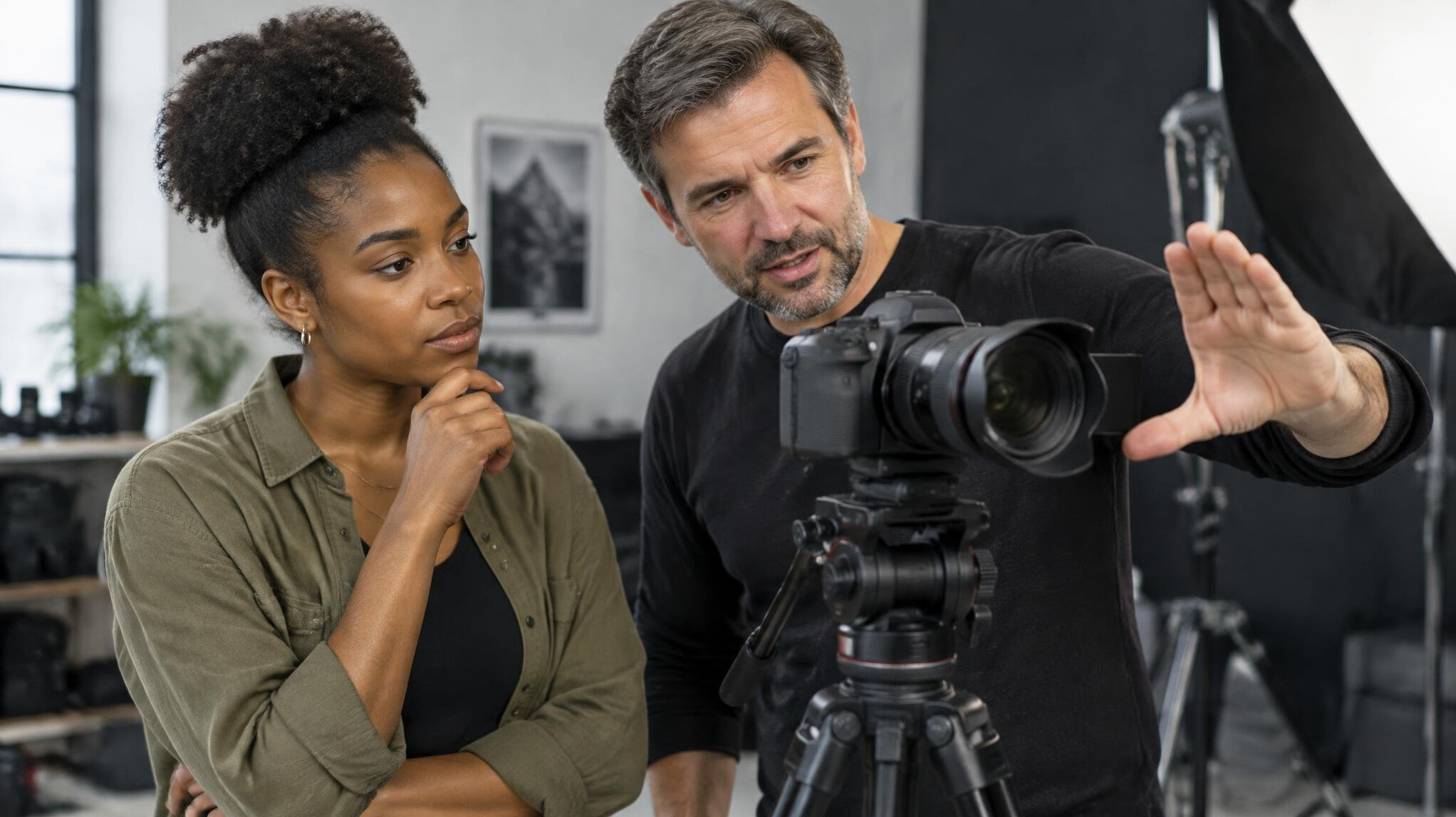 Mentor demonstrating a camera technique to a trainee